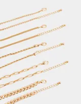 Set de 5 pulseras doradas con diferentes diseños de cadenas.