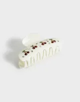 Broche para el pelo color crema con diseño de cerezas y strass.