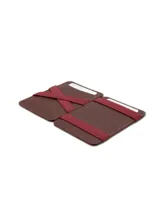 Billetera compacta de cuero negro con sistema mágico de correas elásticas para billetes y ranuras para tarjetas. Incluye protección RFID.