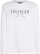 Remera blanca de manga larga con cuello redondo y logo de Tommy Hilfiger estampado en el pecho.