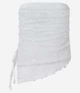 Top sin breteles de lentejuelas color blanco, con escote recto y lazo fruncido en el lateral.