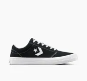 Championes urbanos de lona negra con detalles en blanco, suela de goma blanca y logo de Converse en el lateral.