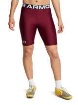 Calza deportiva Under Armour HeatGear de tiro alto, color borgoña, con pretina ancha con logo de la marca y logo estampado en la pierna izquierda.