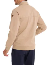 Campera bomber color beige de algodón orgánico con spandex, corte regular, cuello, puños y pretina acanalados, cierre frontal, bolsillos delanteros con solapa y broches ocultos, bolsillos internos y forro de franela.
