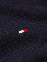 Sweater cardigan azul marino de algodón con cuello en V, cierre con botones y logo de Tommy Hilfiger bordado en el pecho.