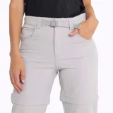 Pantalón de trekking negro desmontable, con cintura elástica, cinturón interno ajustable, bolsillos con cierre y elástico en los tobillos.