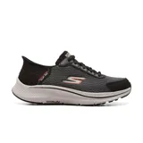 Championes deportivos Skechers Hands Free Slip-ins: GO RUN Consistent 2.0 - Empowered, color negro con detalles en gris y naranja. Diseñados con sistema Heel Pillow, capellada de malla con cordones ajustables, amortiguación ULTRA LIGHT y plantilla Skechers Air-Cooled Memory Foam.