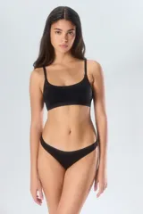 Colaless blanca de poliamida y elastano con forro de algodón.