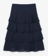 Pollera midi de crepé azul marino con lunares blancos, cintura elástica y volados en capas.