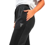Pantalón de jogging gris con efecto lavado, corte recto y logo estampado en la pierna izquierda.