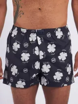 Bóxer de algodón blanco con estampado de flores pequeñas color celeste, con cintura elástica y logo de la marca en el centro.