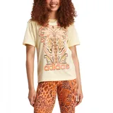 Remera Adidas de corte clásico, color crema con estampado de flores, jaguares y el logo de Adidas en color naranja.