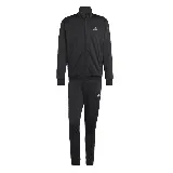 Conjunto deportivo Adidas de hombre, compuesto por campera con cierre y pantalón largo. Diseño negro con logo Adidas en blanco.