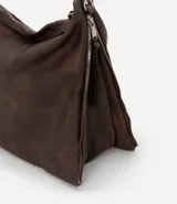 Bolso hobo grande desestructurado de PU color negro, con correa de mano, correa larga desmontable, cierre lateral ajustable con tiradores y cierre superior.
