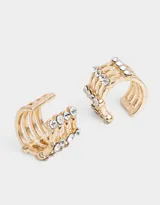 Set de dos earcuffs dorados de metal con strass.