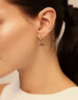 Aro piercing de plata 925 bañada en oro con dije colgante en forma de ojo con cristal amatista.