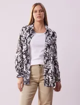 Camisa de lino estampada en blanco y negro con diseño de hojas, marca Zac & Rachel. Tiene cuello con solapa, abertura central con botones, bolsillo aplicado en la parte delantera y mangas largas regulables con presilla y botón.