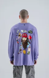Remera lila de algodón con corte oversize, mangas largas y estampa frontal con la frase "La vida es como una caja de bombones, nunca sabes lo que te va a tocar".