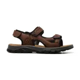 Sandalias marrones de cuero con ajuste de velcro en el empeine y tobillo, y suela negra.