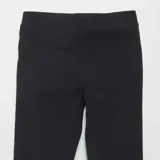 Legging negro liso con cintura elástica.