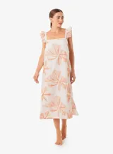 Vestido midi color blanco con estampado de flores color naranja, de breteles anchos con volados.