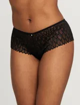 Conjunto de lencería Réne Rofé, compuesto por un soutien de encaje negro con microtul y un panty brasilero de encaje negro con microtul.