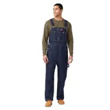 Pantalón de trabajo Dickies, tipo overol, confeccionado en denim color azul índigo.