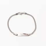 Pulsera de acero plateado con eslabones tipo cadena y placa rectangular central para grabar.
