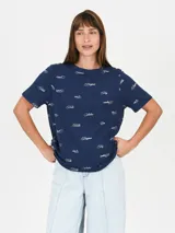 Remera color salmón con estampado de flor blanca y texto "Venice California".