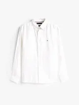 Camisa de lino blanco de manga larga con cuello clásico y cierre frontal de botones. Presenta un pequeño logo bordado de Tommy Hilfiger en el pecho.