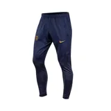 Pantalón de fútbol Nike del Paris Saint-Germain, modelo Strike. Diseño azul marino con detalles en dorado y patrón geométrico en la parte inferior de las piernas.