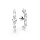 Set de tres caravanas Swarovski color plateado, con incrustaciones de circonitas y perlas. Incluye dos caravanas tipo ear cuff y una caravana tradicional. Baño de rodio.