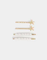 Set de cuatro horquillas doradas para el pelo, dos con apliques de estrellas de mar y dos con apliques de perlas.