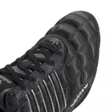Zapatillas Adidas Adi Racer Low color negro con detalles plateados y diseño acolchado.
