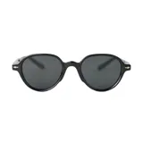 Lentes de sol con montura redonda color gris y detalles dorados en las patillas.