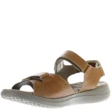 Sandalias negras de mujer, estilo casual, con tiras ajustables mediante velcro en el empeine y tobillo. Presentan una suela gruesa y ergonómica con plantilla contorneada. Se observa un logo grabado en la tira del tobillo.