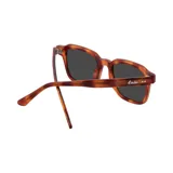 Lentes de sol Indie con montura cuadrada de acetato color carey y lentes grises.
