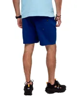 Short de baño azul con cintura elastizada, cordón de ajuste y logo de triángulo amarillo en la pierna derecha.