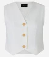 Chaleco negro de crepé con escote en V y abotonadura dorada. Corte slim y sin mangas.