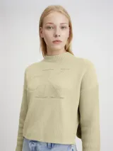 Sweater de punto color beige con cuello redondo y logo CK en el frente. Corte cropped y textura de canalé.
