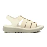 Sandalias negras con tiras elásticas entrecruzadas y pulsera al tobillo. Plataforma baja con suela texturizada.