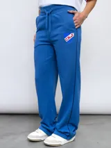 Pantalón de jogging azul con el escudo del Club Nacional de Football y el logo de Umbro.