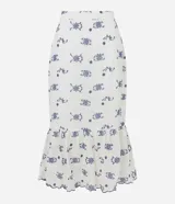 Pollera midi de laise color blanco con bordado de flores y diseño boho.
