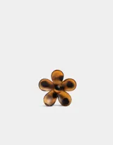 Broche para el pelo con forma de flor color negro.