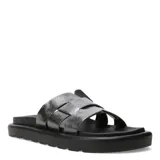Sandalias bajas negras con tiras anchas cruzadas en la parte superior.