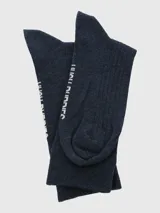 Calcetines largos azul marino acanalados con logo de perro bordado en el tobillo.