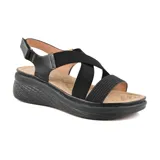 Sandalias de mujer color beige con tiras cruzadas elásticas y suela de plataforma.