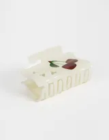 Broche rectangular de acrílico color crema para el pelo, con diseño de cerezas y estrellas.
