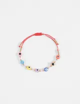 Pulsera elástica con cuentas de colores con diseño de ojo turco, cuentas doradas y pequeñas cuentas de cristal.