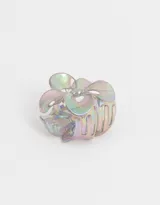 Broche para el pelo en forma de flor holográfica.